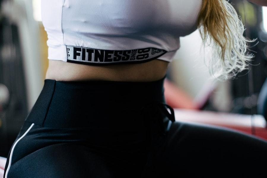 woman wearing a fitness crop top and joggers