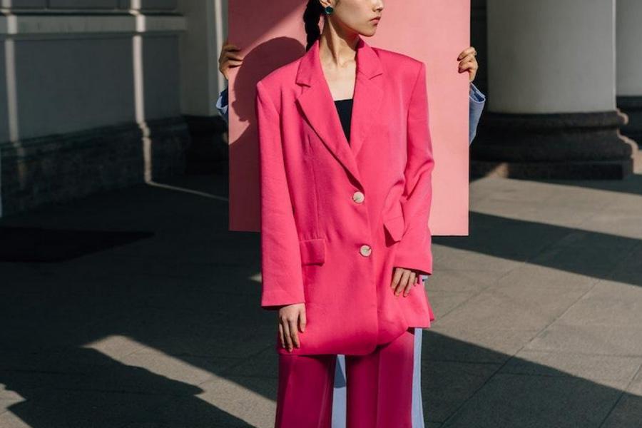 Woman wearing a pink tailored suit