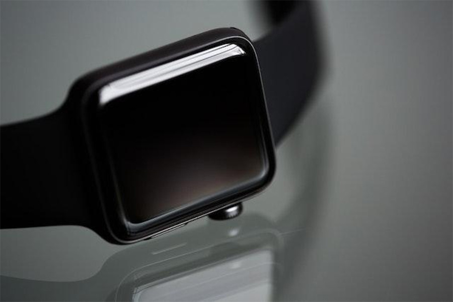 A black smartwatch placed on a table