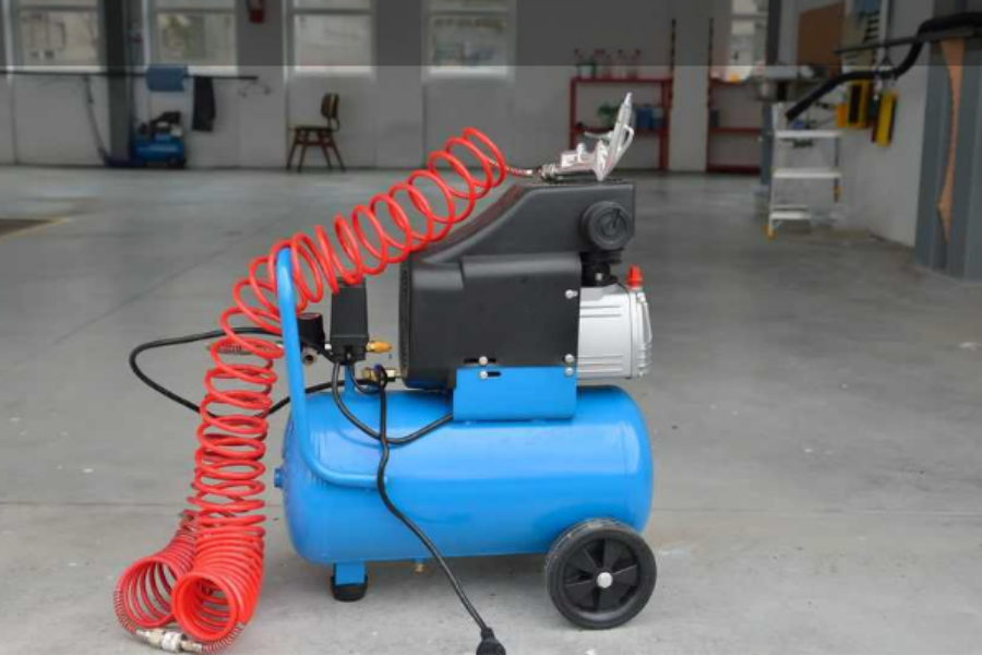 A blue-colored air compressor with wheels
