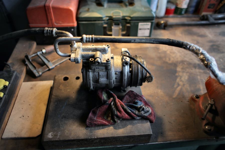 A compressor on a workbench