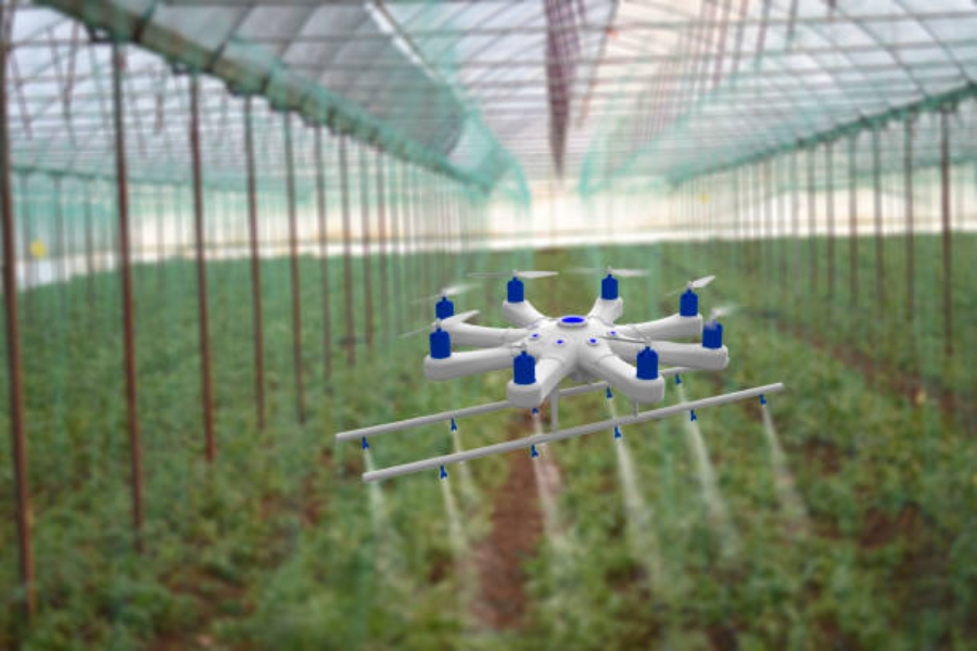 A drone spraying a field in a greenhouse