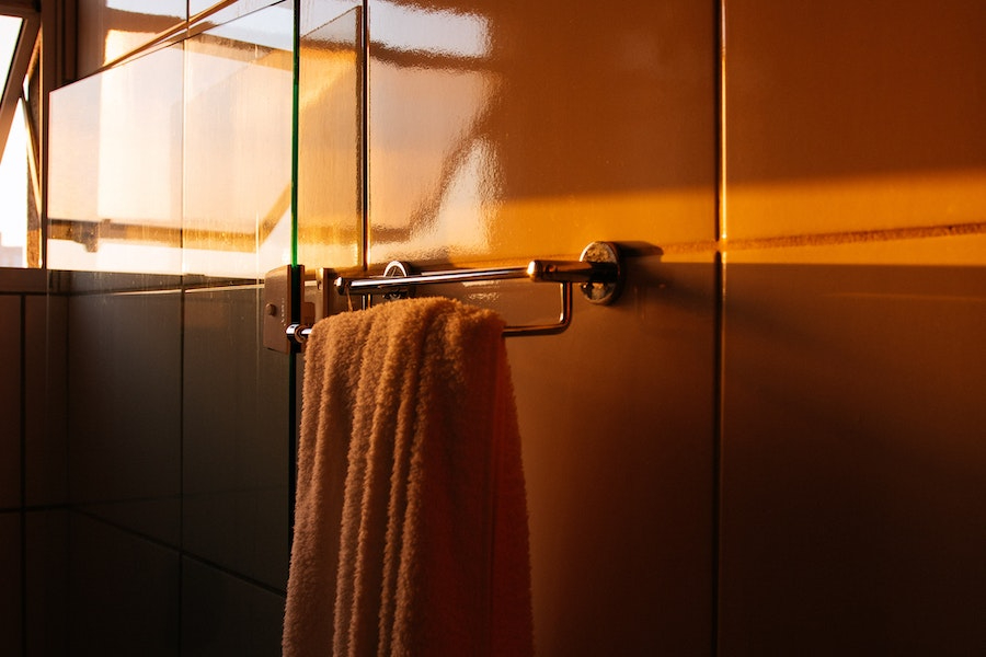A heated towel rail installed in a cozy bathroom