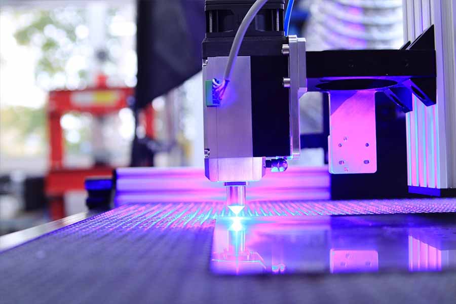 A laser cutting machine emitting laser