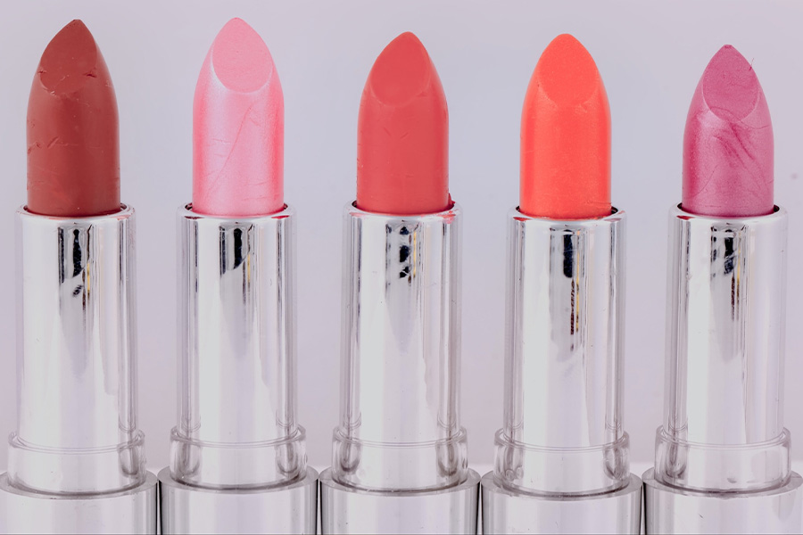 A row of bright colored lipsticks