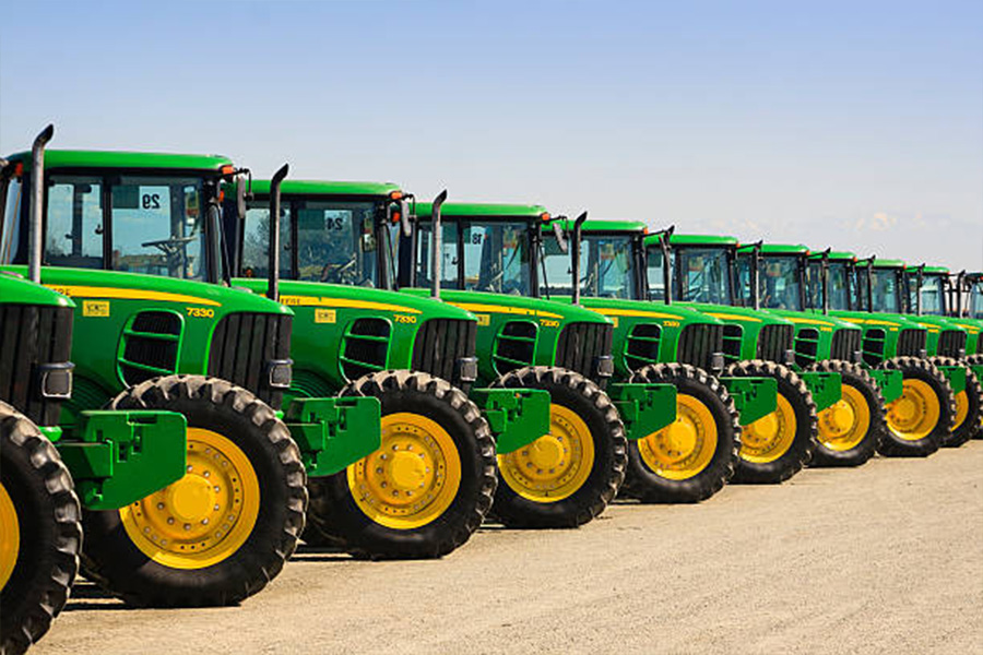 A row of John Deere farm tractors