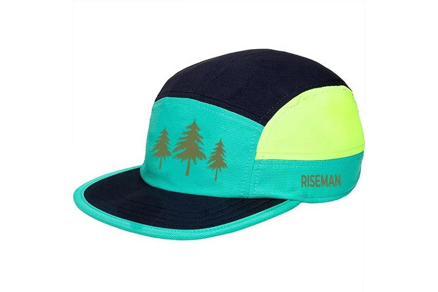 A trail runner cap with print of trees on front