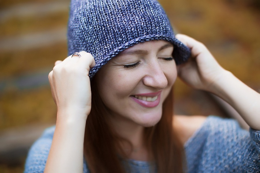 a woman wearing a knitted beanie