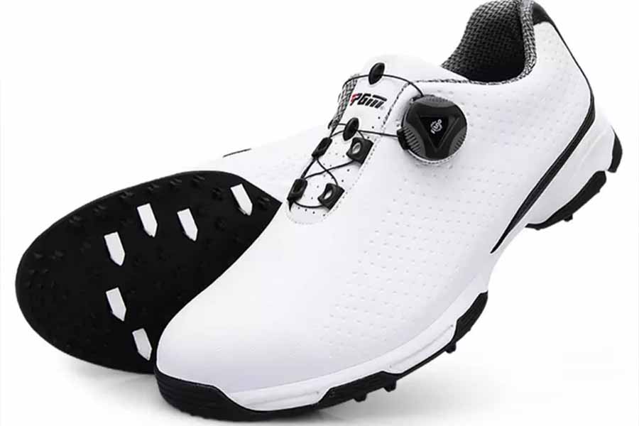 Black and white golf shoes with no spikes on bottom