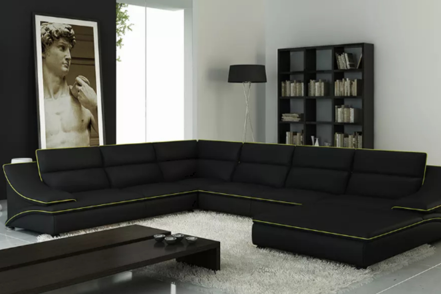Black and white L-shaped Chesterfield sofa