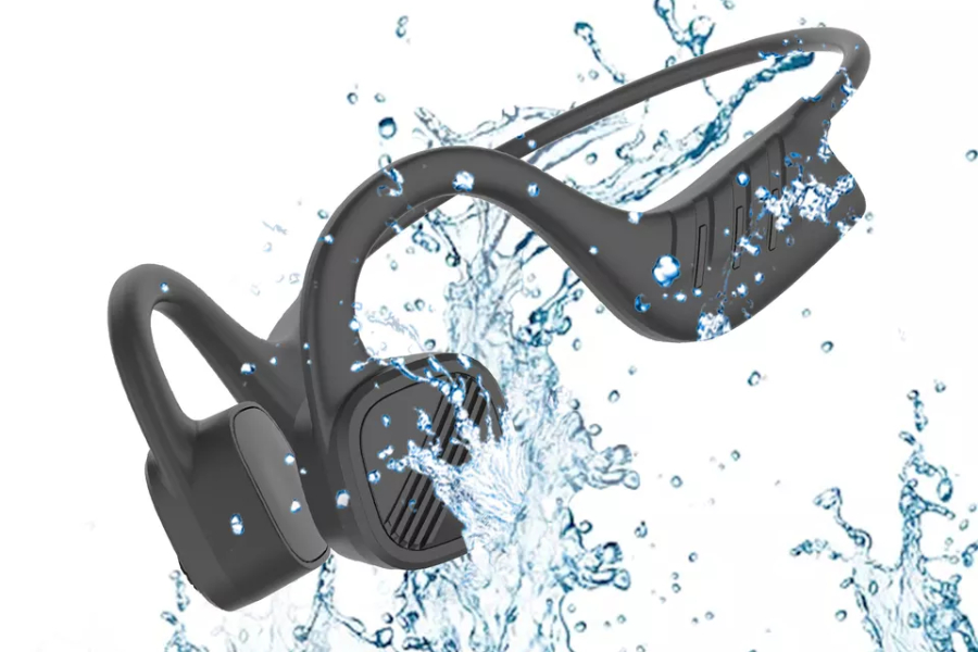 black bone conduction headphones being splashed by water