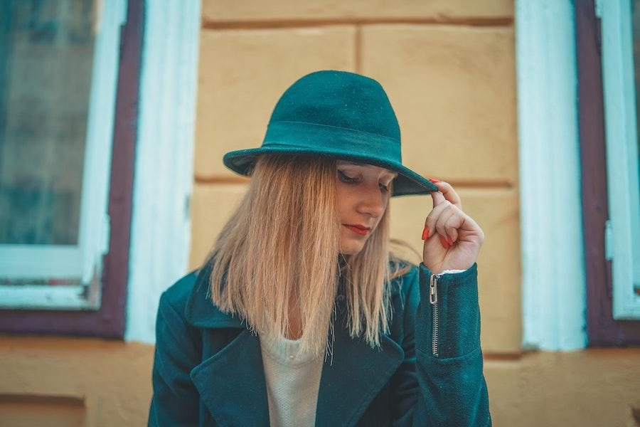 Blonde wearing a blue cloche hat