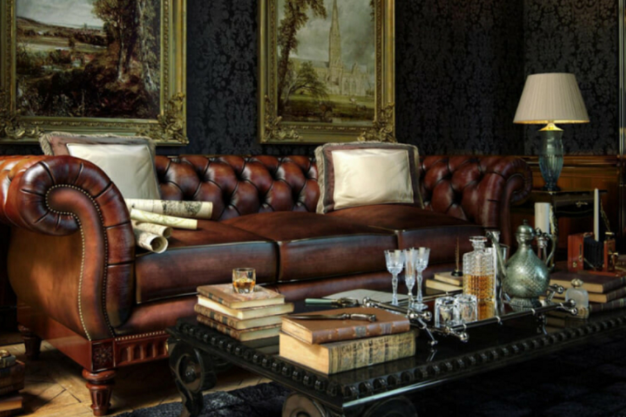 Brown leather Chesterfield sofa with throw pillows and center table