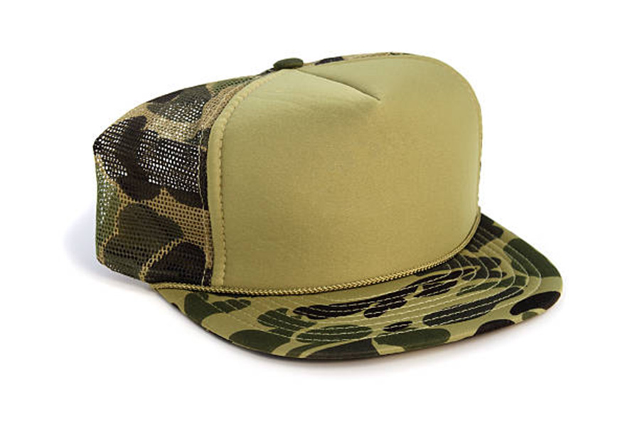 Camouflage hunter’s trucker hat on a white background