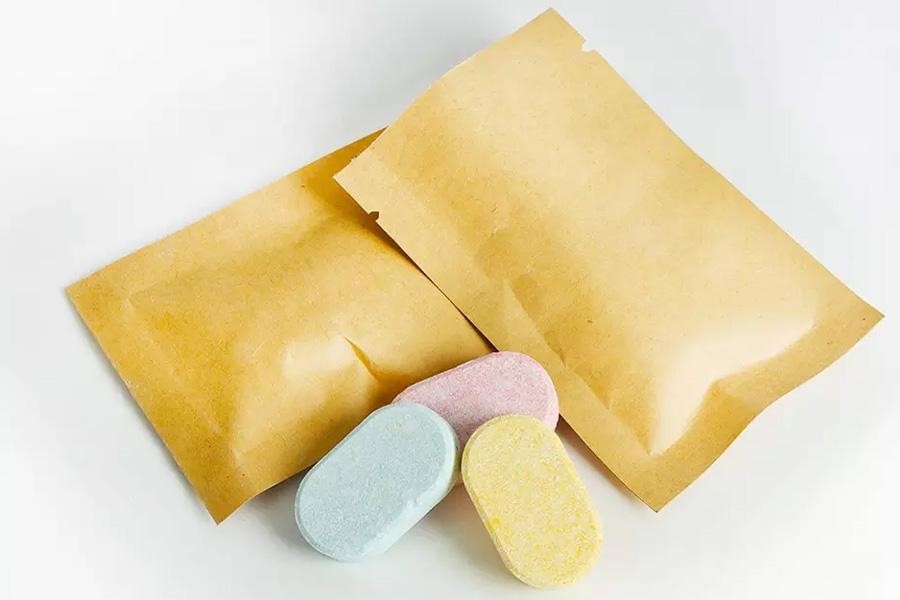 Colorful hand soap foaming tablets in small paper bags