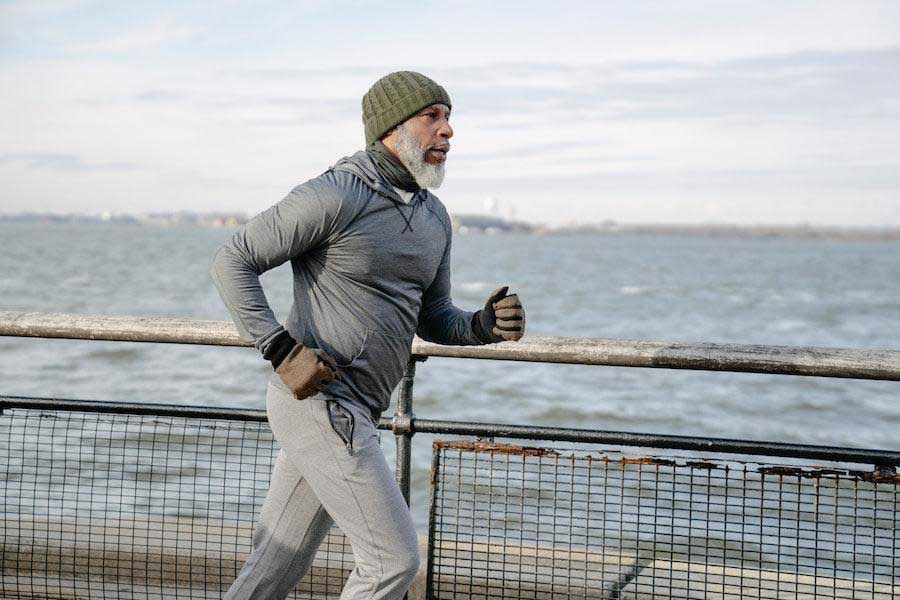 Man jogging with an athleisure outfit