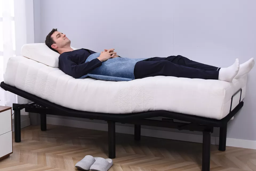 Man laying down on a single bluetooth bed