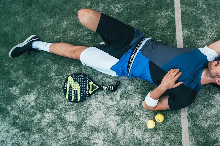 Man wearing modular-styled sportswear while lying down