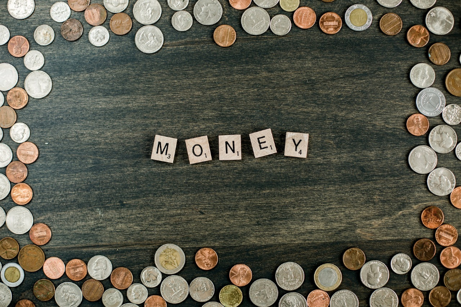 Scrabble tiles arranged to show the word “money