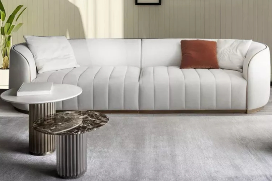 Three-seater Italian modern velvet sofa and three throw pillows