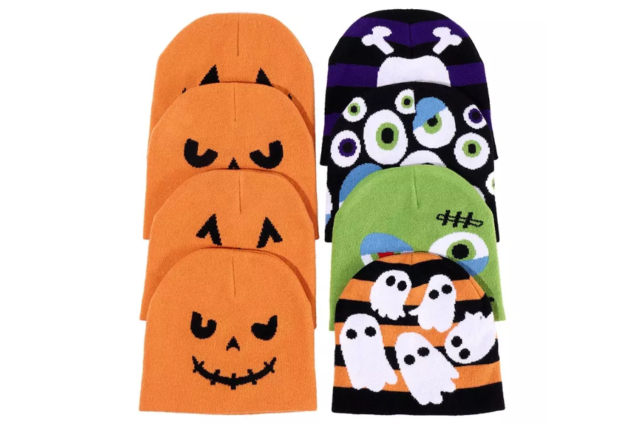 Various Halloween themed knitted hats with designs on them