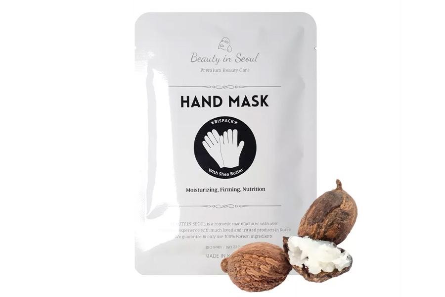 White package with hand masks inside in coconut scent