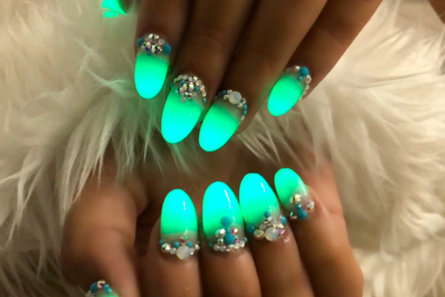 Woman showing glow-in-the-dark nails