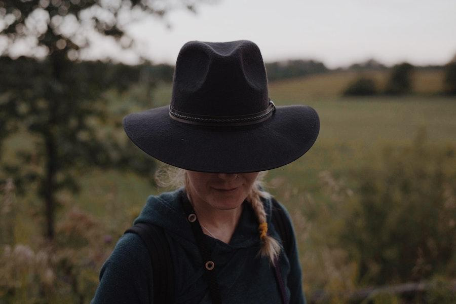 Woman wearing a black cowboy hat