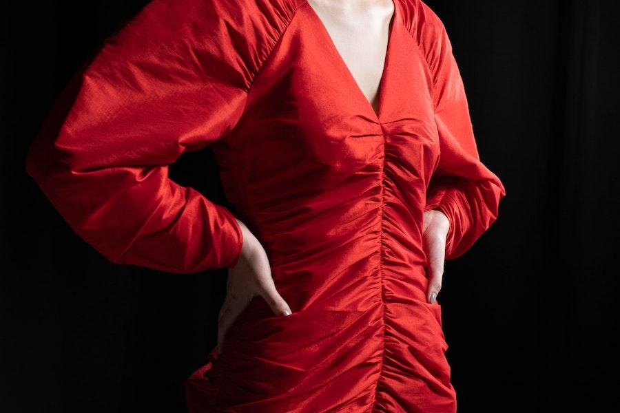 Woman wearing a luscious red dress with ruffles
