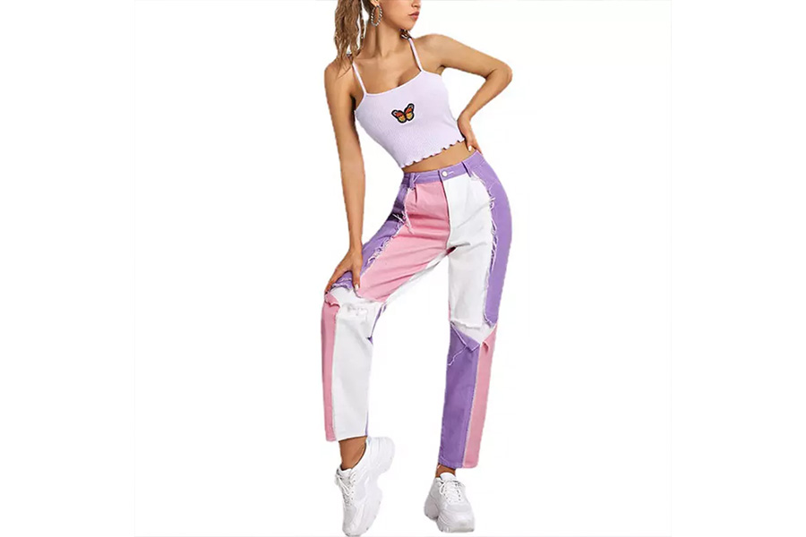 Woman wearing pink, purple, and white patterned jeans