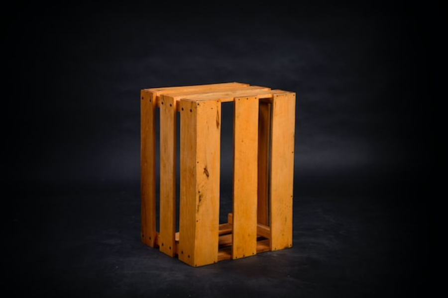 wooden crate isolated on a black background