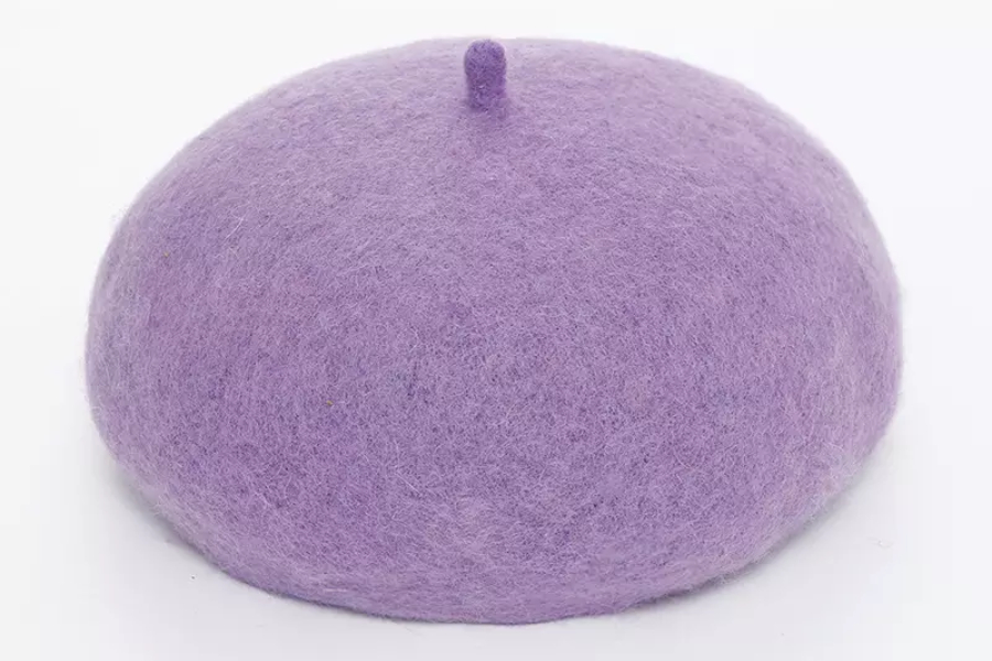 A warm light purple beret used as a winter hat