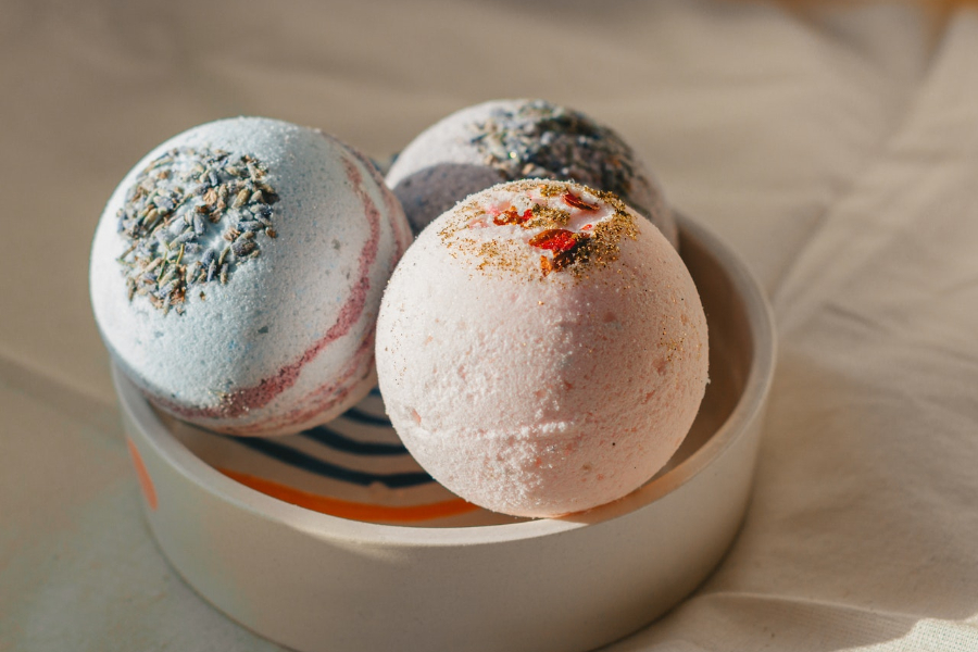 Collection of fragrant bath bombs in bowl