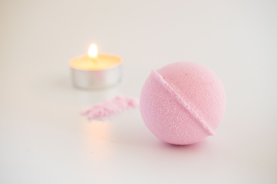 Pink bath bomb on a white background